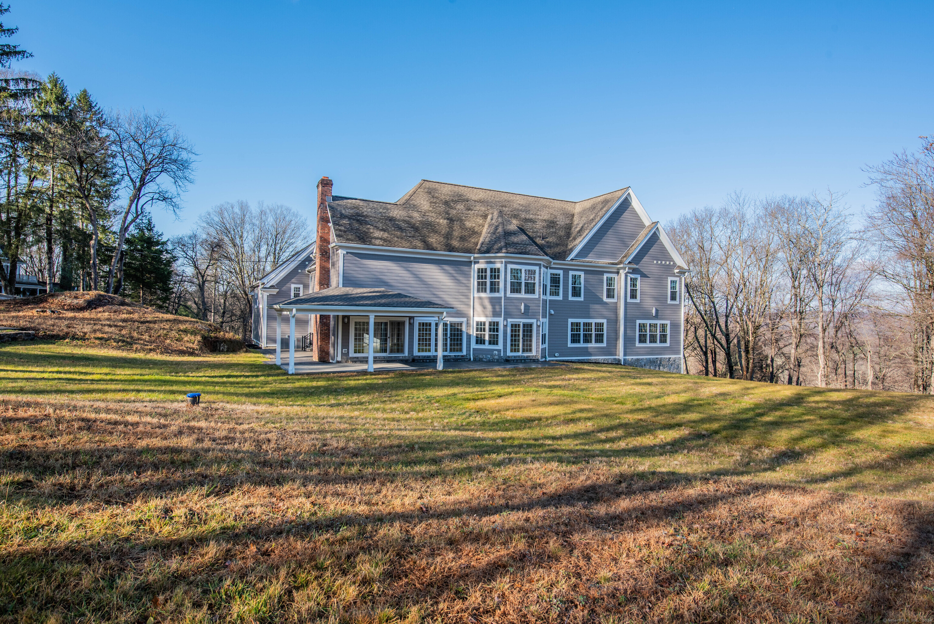 34 Fox Run Road Redding, CT 06896 - Photo 34 of 40 a view of a big house with a big yard and large trees