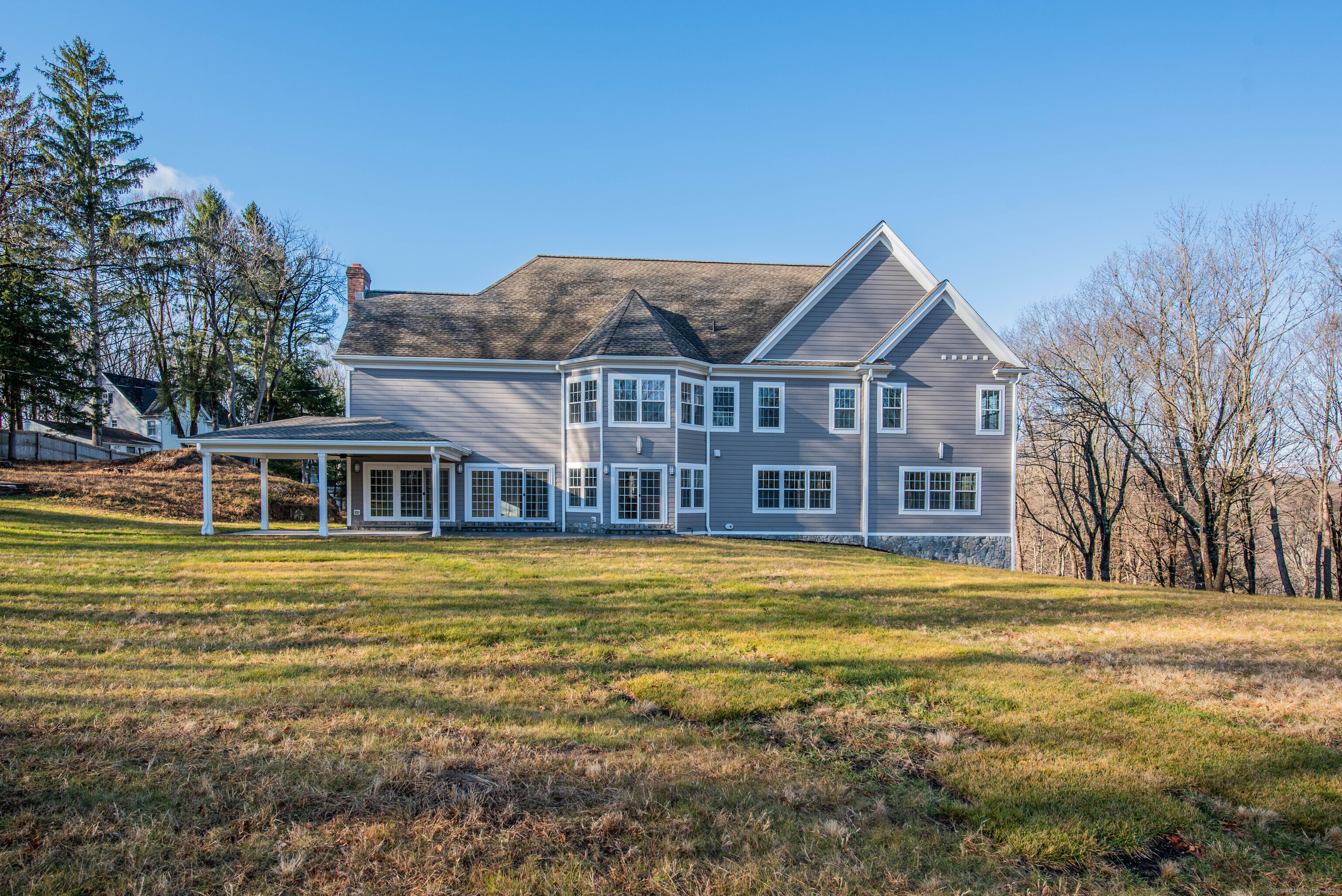34 Fox Run Road Redding, CT 06896 - Photo 35 of 40 a front view of a house with a garden