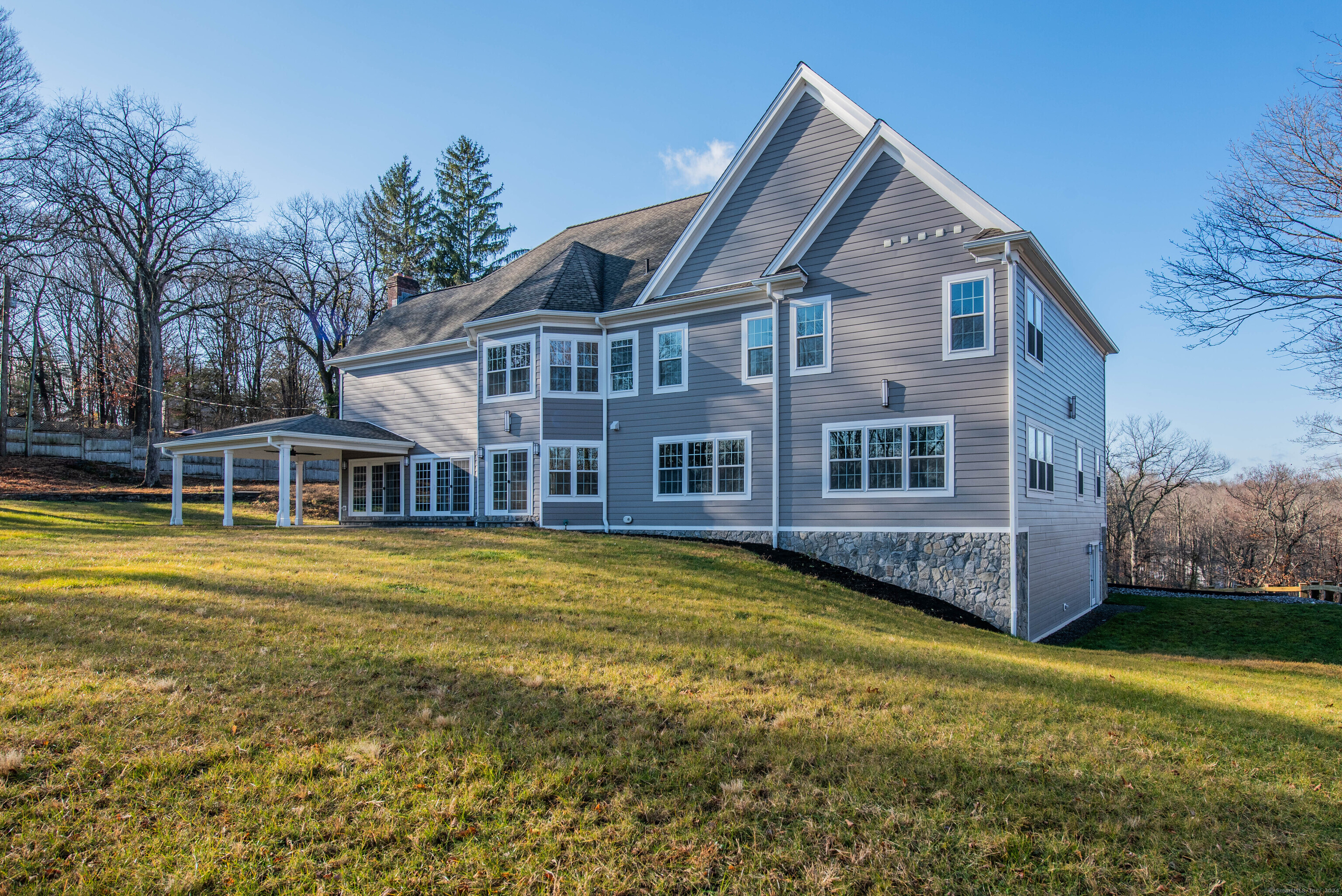34 Fox Run Road Redding, CT 06896 - Photo 36 of 40 a front view of a house with a yard