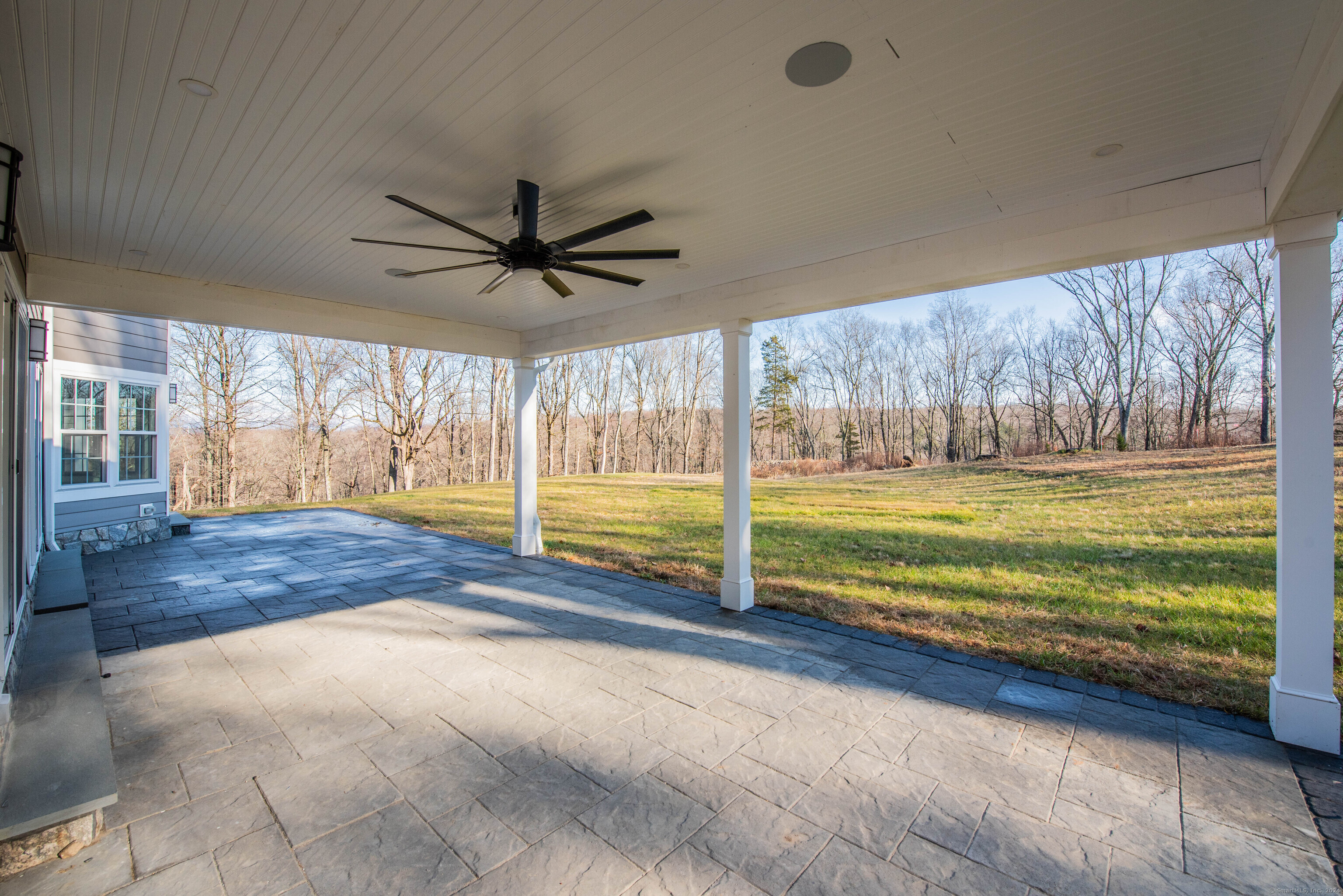 34 Fox Run Road Redding, CT 06896 - Photo 38 of 40 a view of a livingroom with wooden floor and a ceiling fan