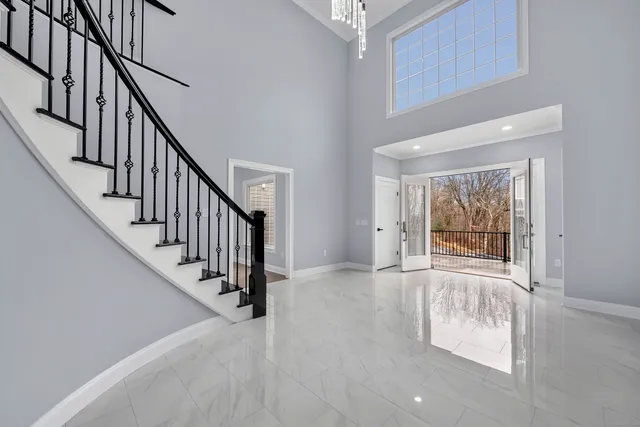 a view of an entryway with wooden floor