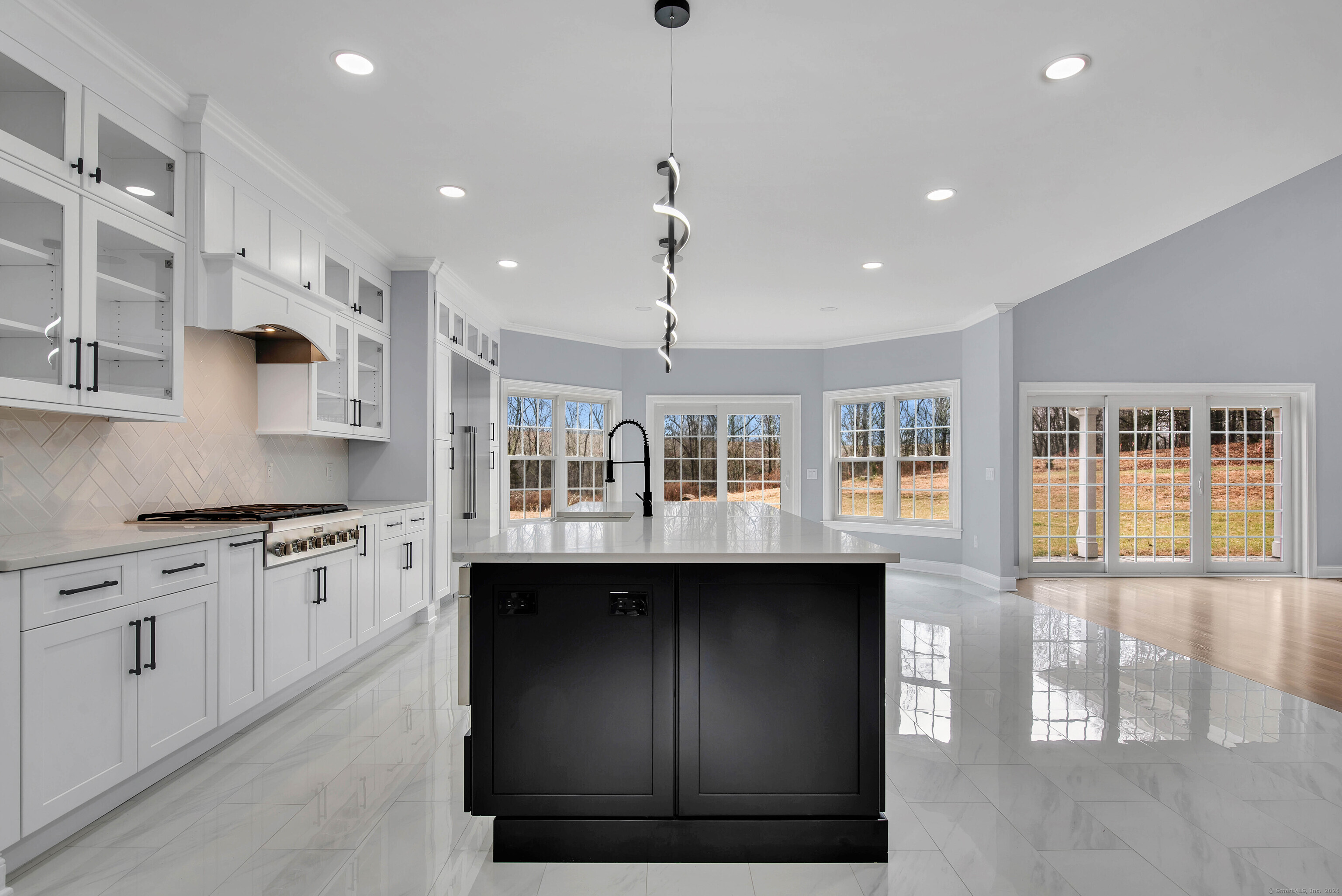34 Fox Run Road Redding, CT 06896 - Photo 8 of 40 a kitchen with stainless steel appliances granite countertop a sink a stove and a wooden floors