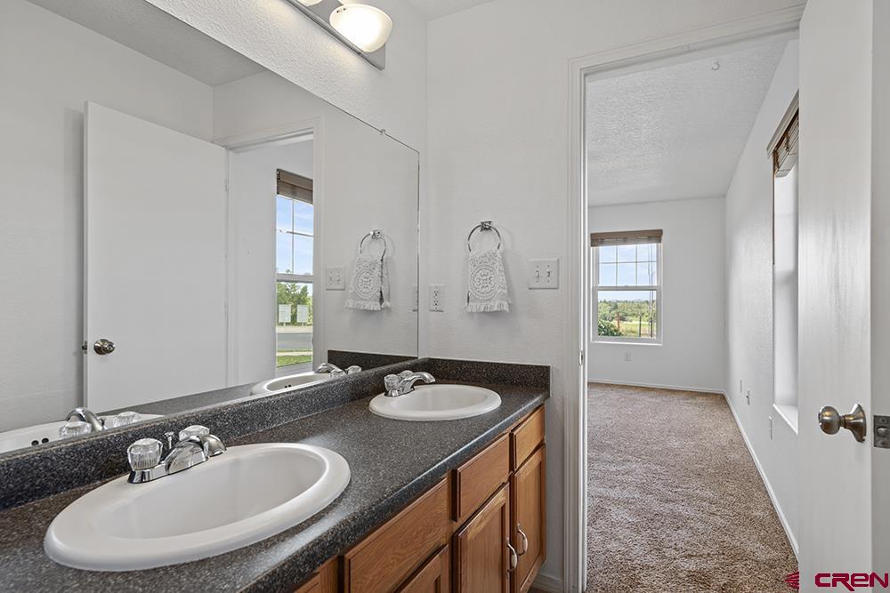 801 Hickory Ridge Bayfield, CO 81122 - Photo 17 of 32 a bathroom with a sink and a mirror