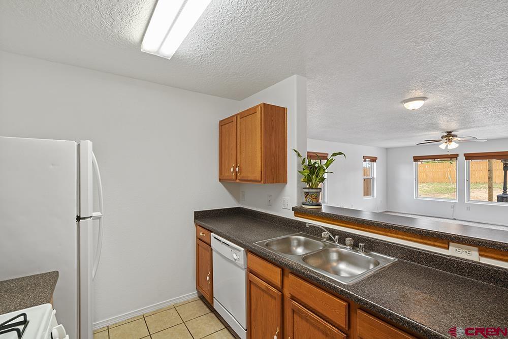 801 Hickory Ridge Bayfield, CO 81122 - Photo 8 of 32 a kitchen with a sink stove and refrigerator