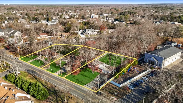 an aerial view of a residential houses with outdoor space