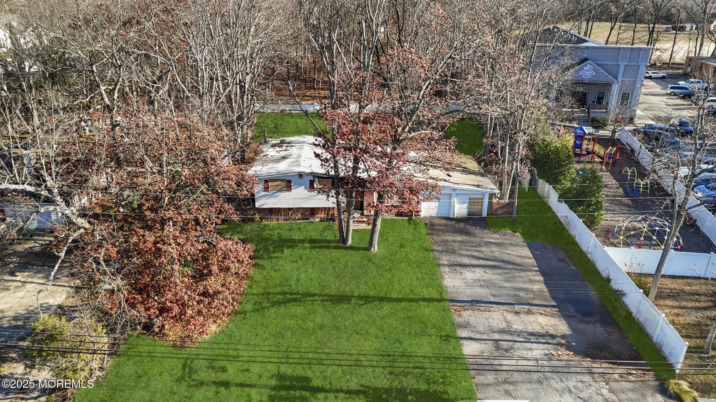 295 Joe Parker Road Lakewood, NJ 08701 - Photo 5 of 9 a front view of a house with a yard