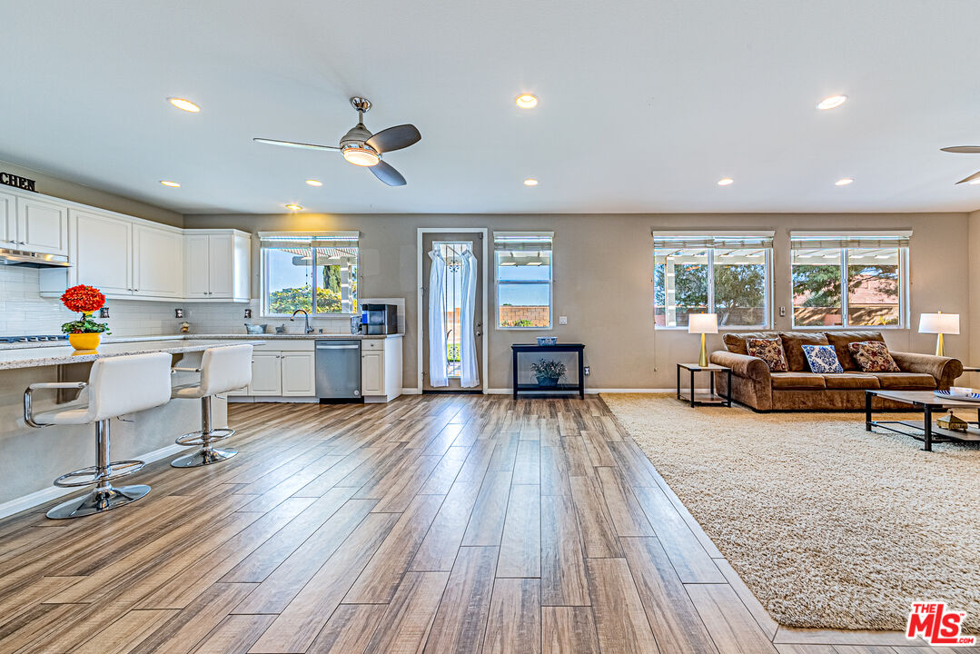 40918 Rise Court Palmdale, CA 93551 - Photo 17 of 45 a living room with furniture and a wooden floor