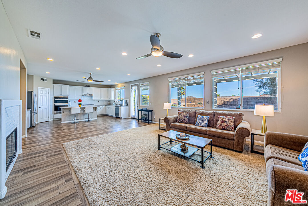 40918 Rise Court Palmdale, CA 93551 - Photo 18 of 45 a living room with furniture and a table