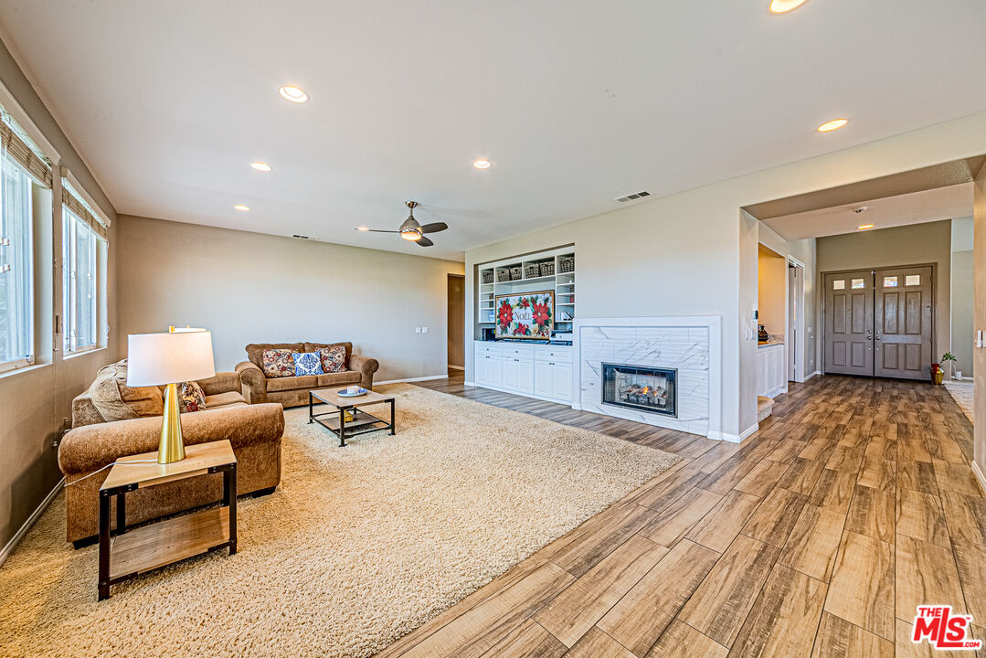 40918 Rise Court Palmdale, CA 93551 - Photo 19 of 45 a bedroom with a bed and a couch