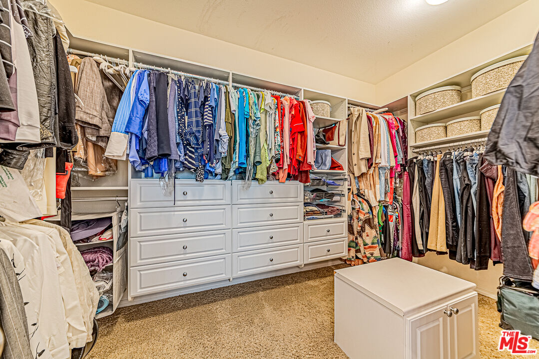 40918 Rise Court Palmdale, CA 93551 - Photo 24 of 45 a view of walk in closet with clothes