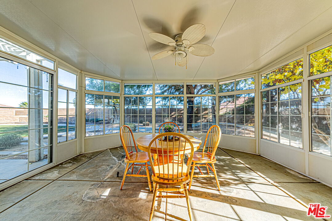40918 Rise Court Palmdale, CA 93551 - Photo 25 of 45 a view of a dining room with furniture water view and a floor to ceiling window