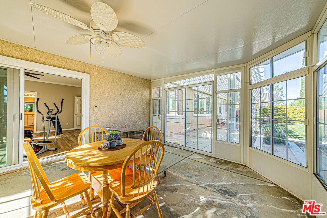 40918 Rise Court Palmdale, CA 93551 - Photo 26 of 45 a bedroom with a bed and wooden floor