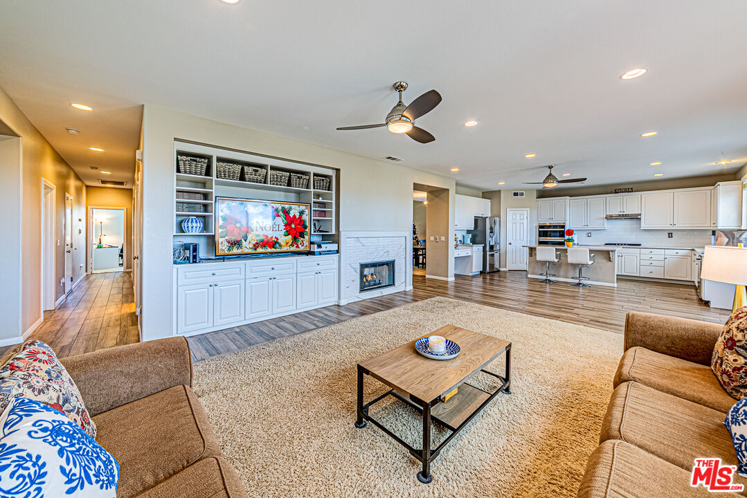 40918 Rise Court Palmdale, CA 93551 - Photo 3 of 45 a living room with furniture and a flat screen tv