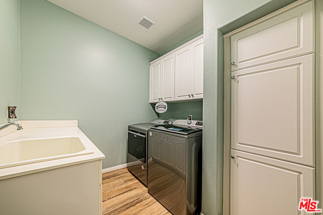 40918 Rise Court Palmdale, CA 93551 - Photo 31 of 45 a room with storage and utility