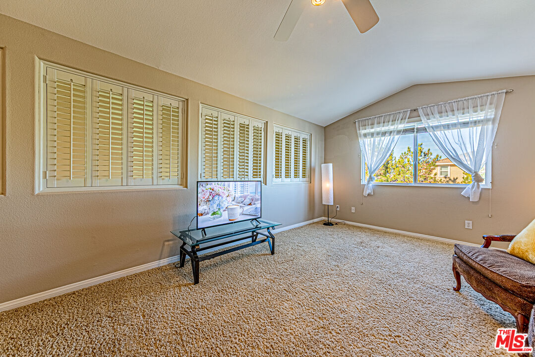 40918 Rise Court Palmdale, CA 93551 - Photo 35 of 45 a living room with furniture and a window