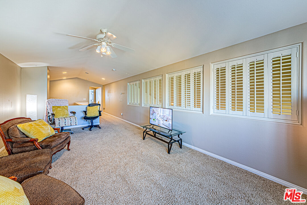 40918 Rise Court Palmdale, CA 93551 - Photo 36 of 45 a living room with furniture and a window