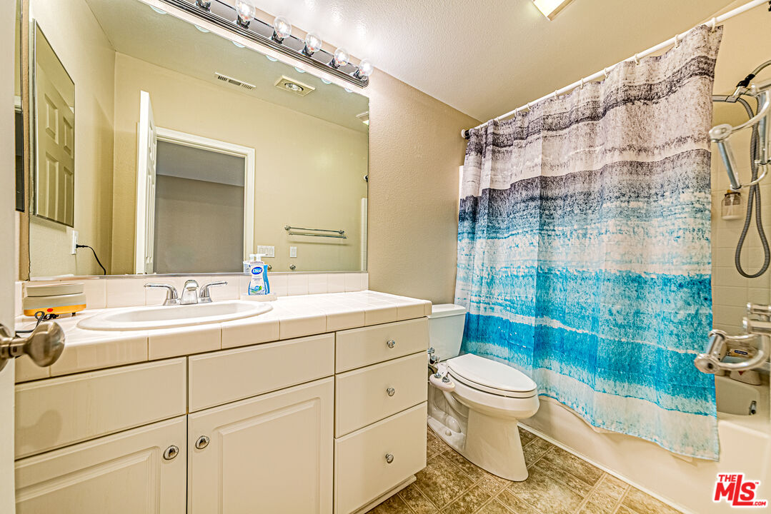 40918 Rise Court Palmdale, CA 93551 - Photo 38 of 45 a bathroom with a sink toilet and shower