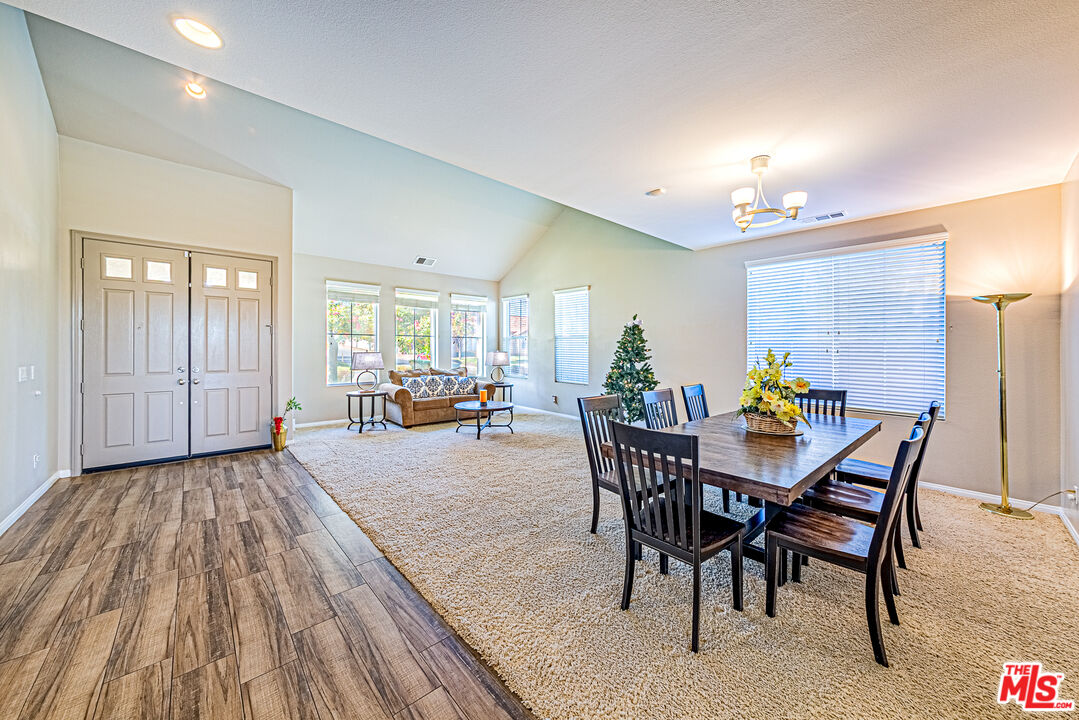 40918 Rise Court Palmdale, CA 93551 - Photo 4 of 45 a view of a dining room with furniture and wooden floor