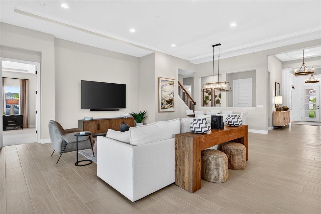 11523 Gleaming Terrace Venice, FL 34293 - Photo 13 of 83 a living room with furniture and a flat screen tv