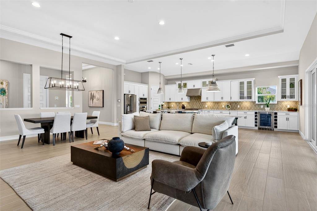 11523 Gleaming Terrace Venice, FL 34293 - Photo 15 of 83 a living room with lots of furniture and a chandelier