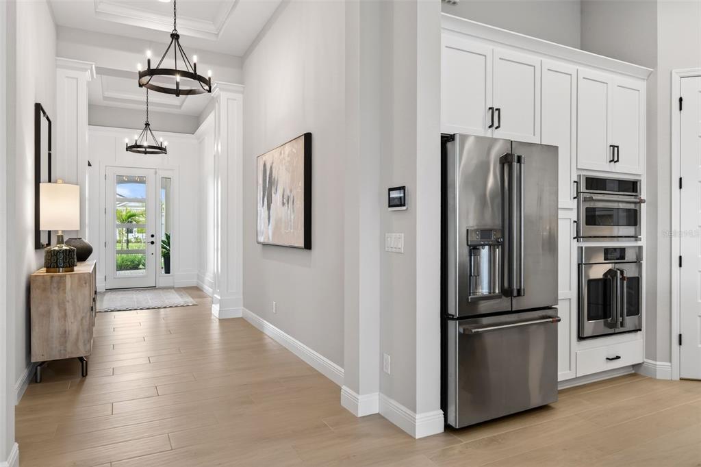 11523 Gleaming Terrace Venice, FL 34293 - Photo 17 of 83 a kitchen with stainless steel appliances granite countertop a refrigerator and a stove