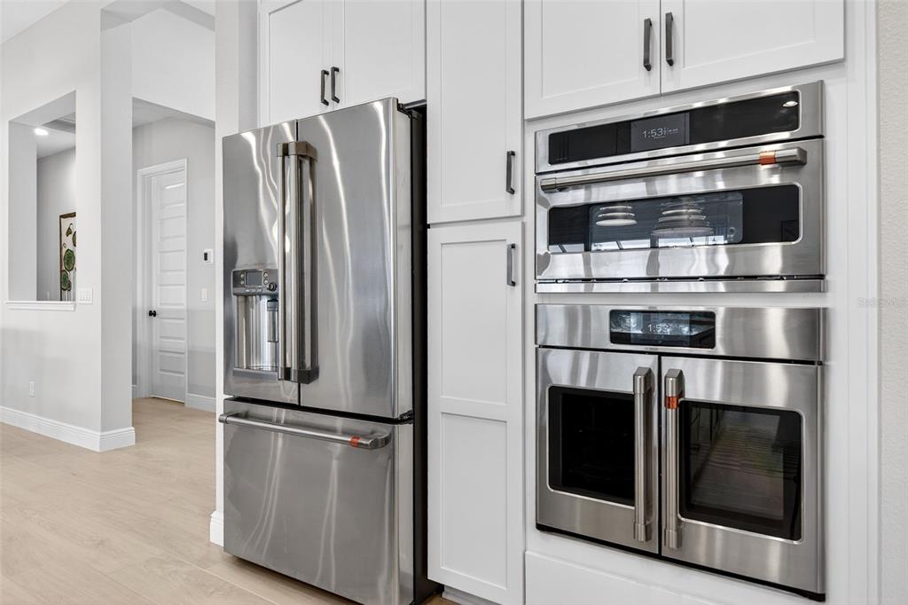 11523 Gleaming Terrace Venice, FL 34293 - Photo 25 of 83 a metallic refrigerator freezer sitting in a kitchen