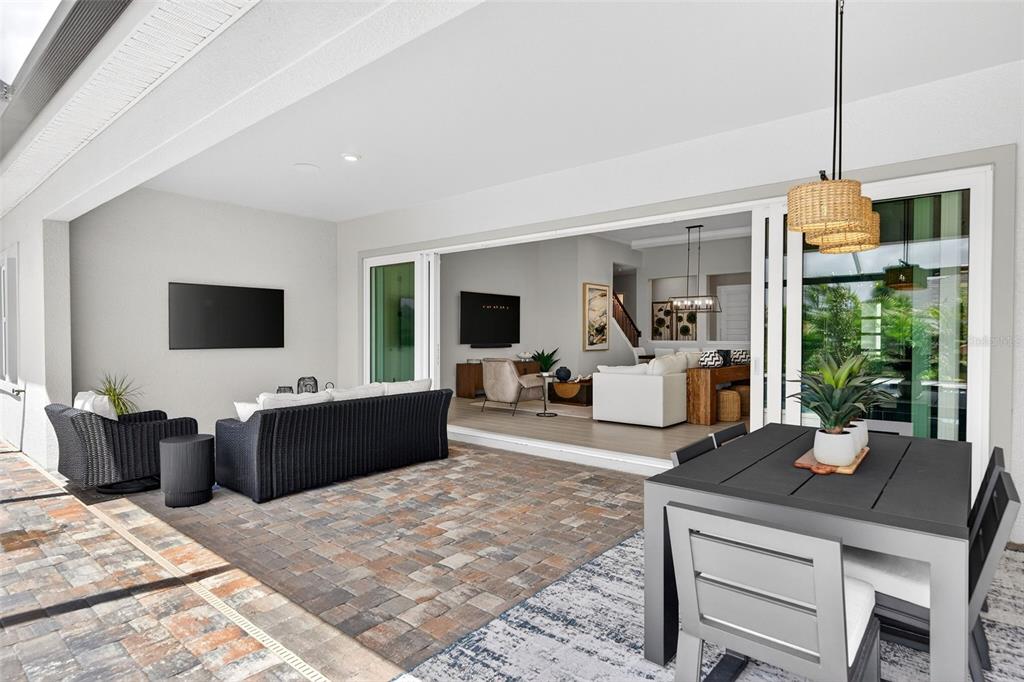 11523 Gleaming Terrace Venice, FL 34293 - Photo 32 of 83 a living room with furniture tv and a large window