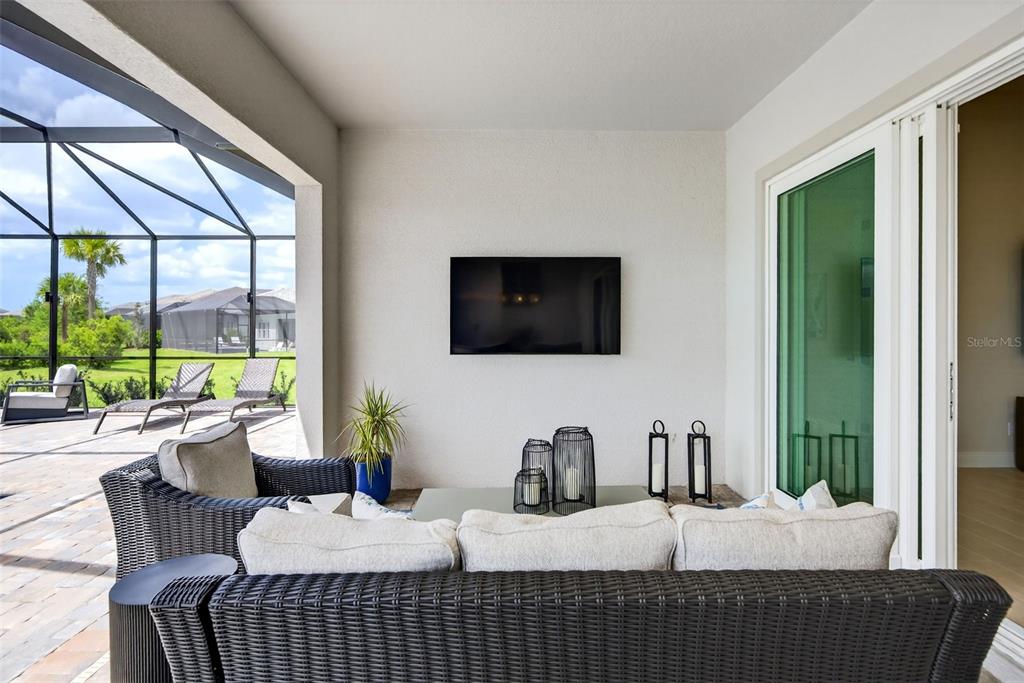 11523 Gleaming Terrace Venice, FL 34293 - Photo 33 of 83 a bedroom with furniture and a flat screen tv