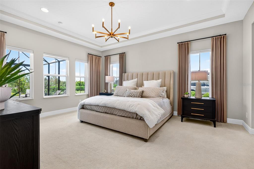 11523 Gleaming Terrace Venice, FL 34293 - Photo 42 of 83 a spacious bedroom with a bed and a large window