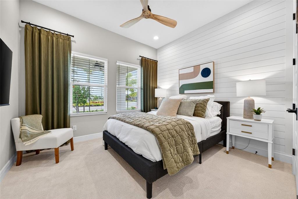 11523 Gleaming Terrace Venice, FL 34293 - Photo 46 of 83 a spacious bedroom with a bed and a couch