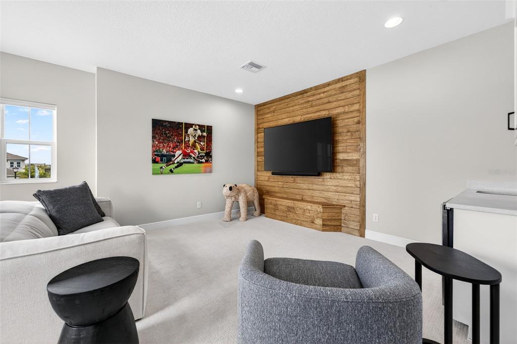 11523 Gleaming Terrace Venice, FL 34293 - Photo 53 of 83 a living room with furniture and a flat screen tv