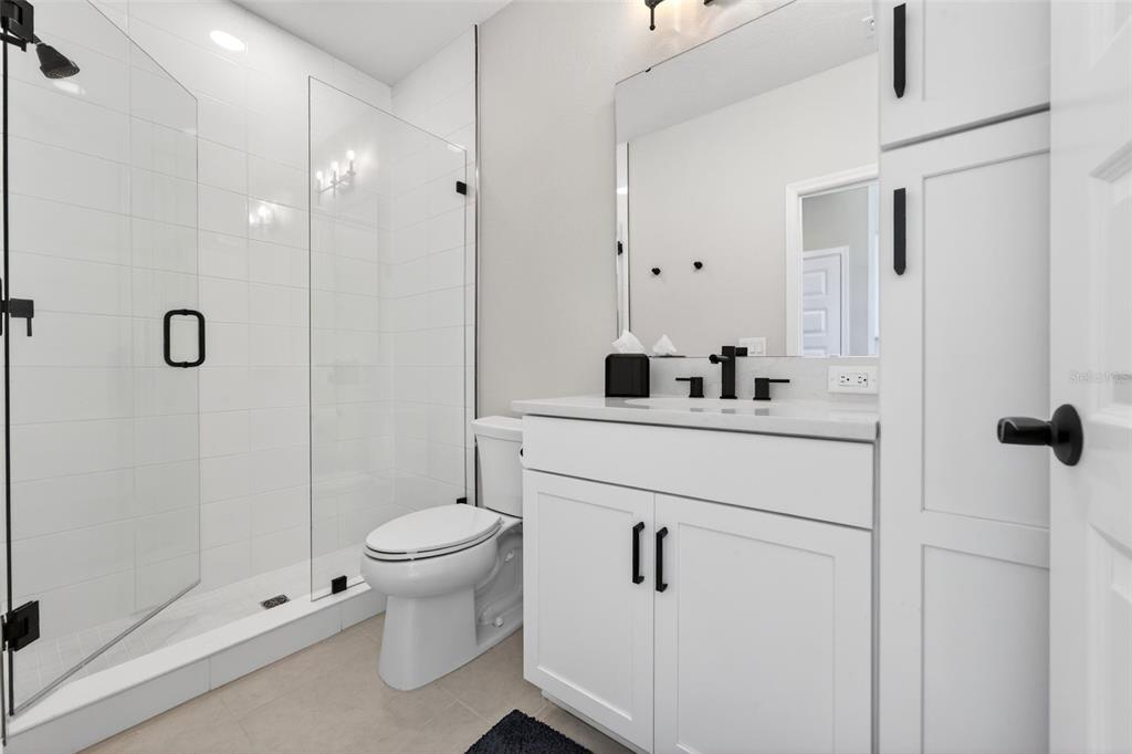 11523 Gleaming Terrace Venice, FL 34293 - Photo 55 of 83 a bathroom with a sink a toilet and shower