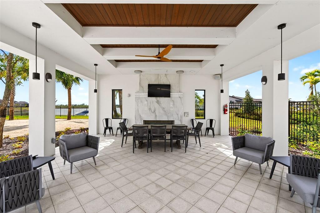 11523 Gleaming Terrace Venice, FL 34293 - Photo 67 of 83 a living room with furniture and a flat screen tv