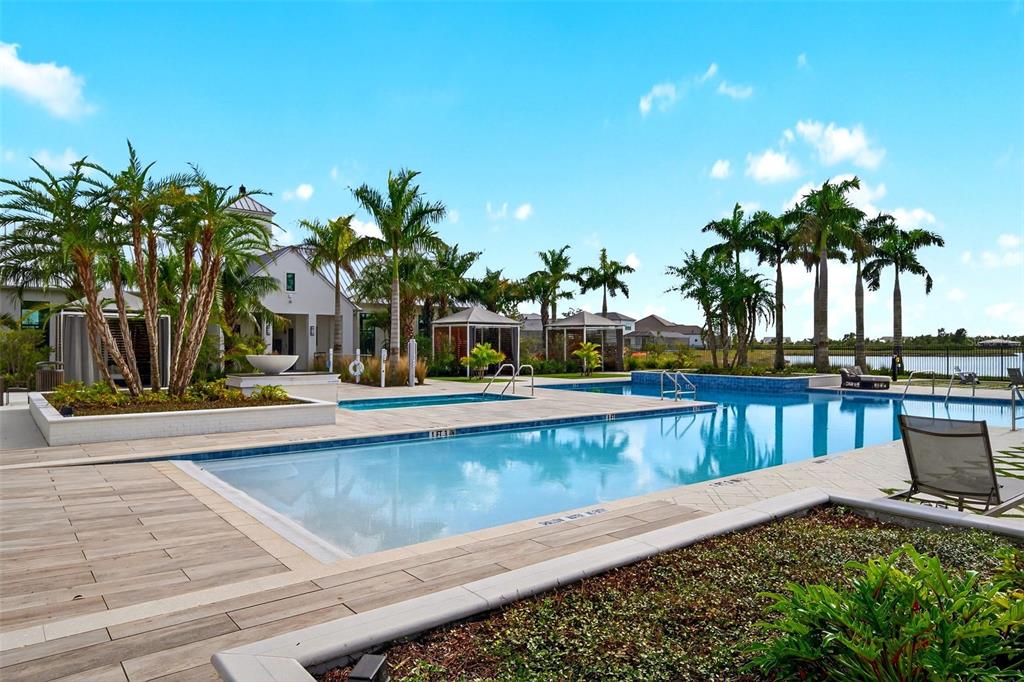 11523 Gleaming Terrace Venice, FL 34293 - Photo 69 of 83 a view of swimming pool with outdoor seating and plants