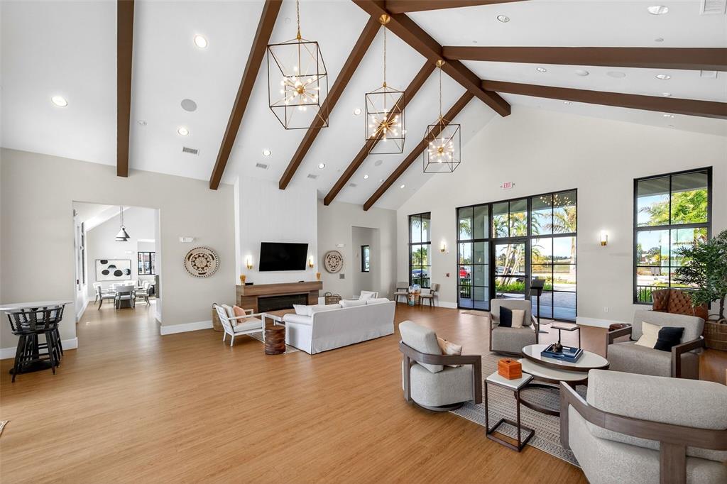 11523 Gleaming Terrace Venice, FL 34293 - Photo 71 of 83 a living room with furniture and a flat screen tv