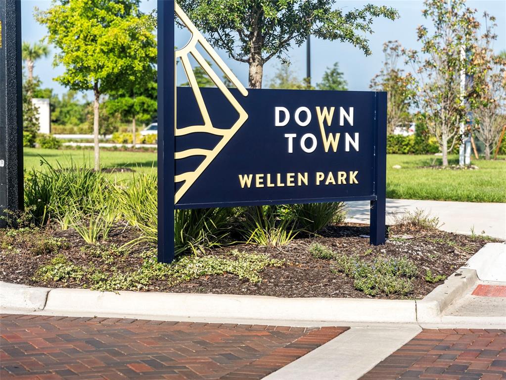 11523 Gleaming Terrace Venice, FL 34293 - Photo 74 of 83 a street sign that is sitting in front of a wooden house