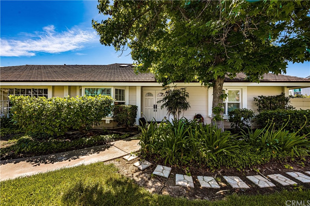 157 West Yale Loop, Unit 7 Irvine, CA 92604 - Photo 1 of 1 a front view of a house with a garden