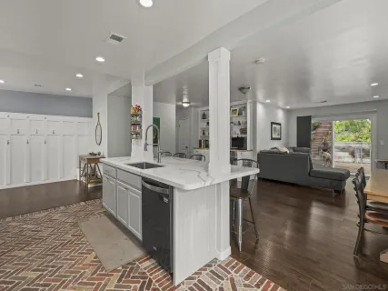 a kitchen with stainless steel appliances granite countertop a stove and a refrigerator