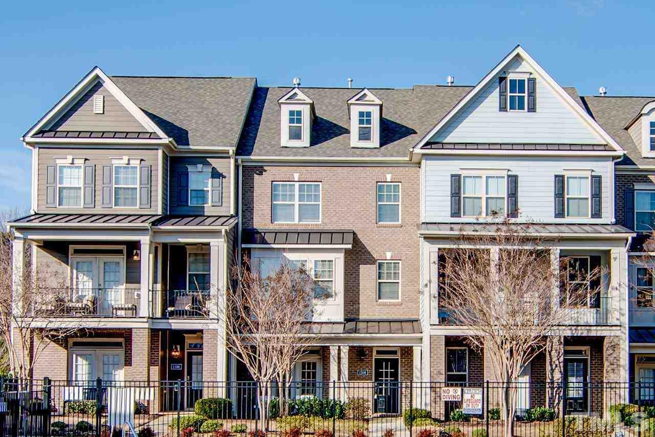 1308 Cornell Place Raleigh, NC 27607 - Photo 1 of 25 a front view of a residential apartment building with a yard