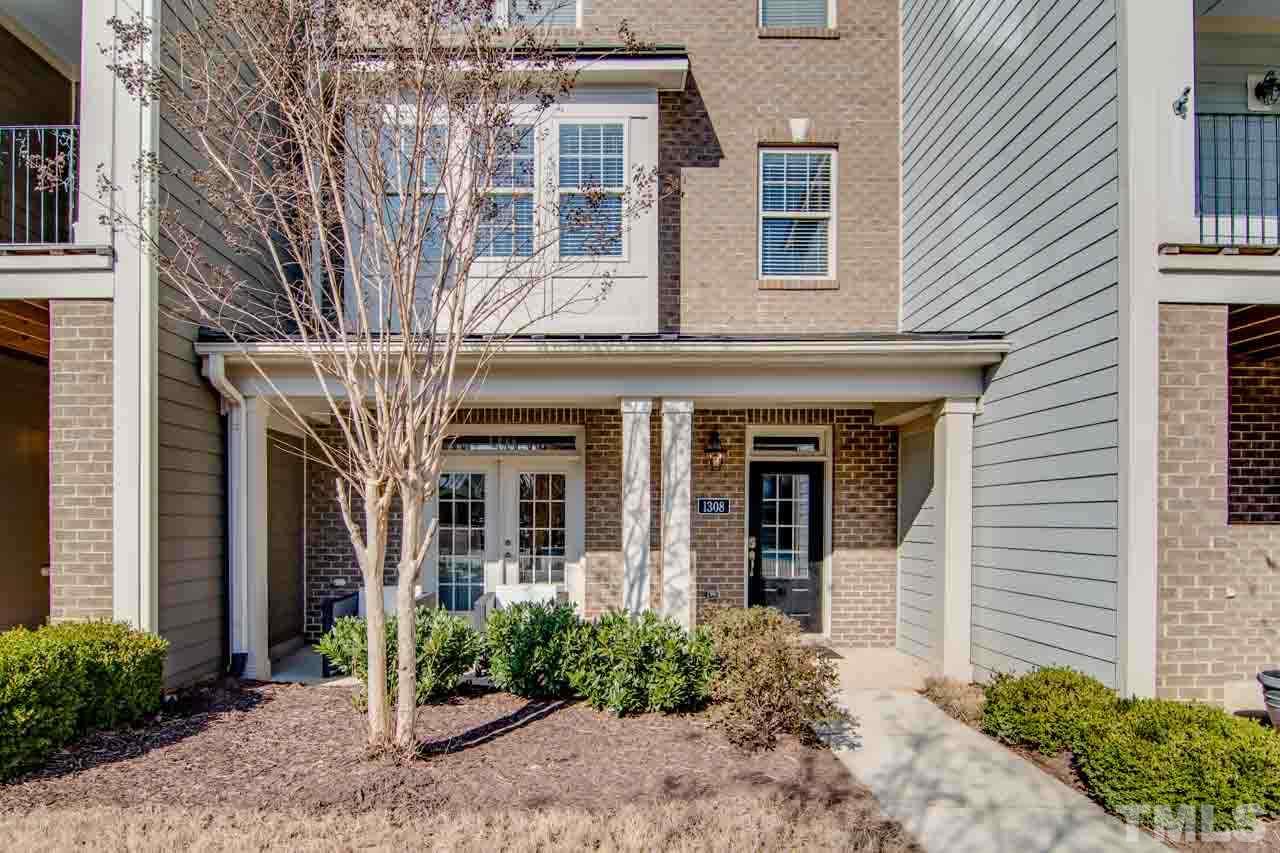 1308 Cornell Place Raleigh, NC 27607 - Photo 2 of 25 front view of a house with a small yard