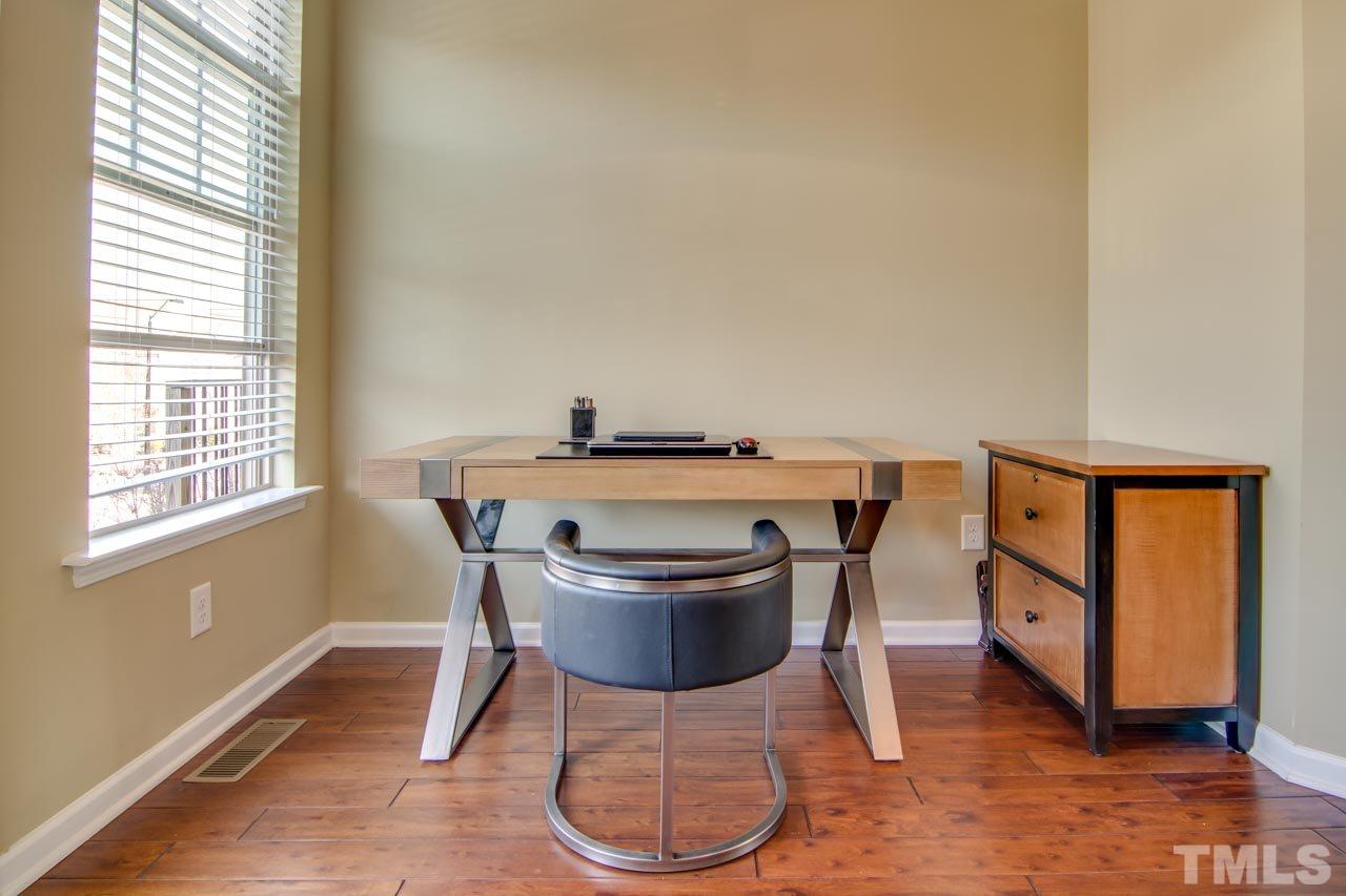 1308 Cornell Place Raleigh, NC 27607 - Photo 11 of 25 a view of a dining room with furniture and wooden floor