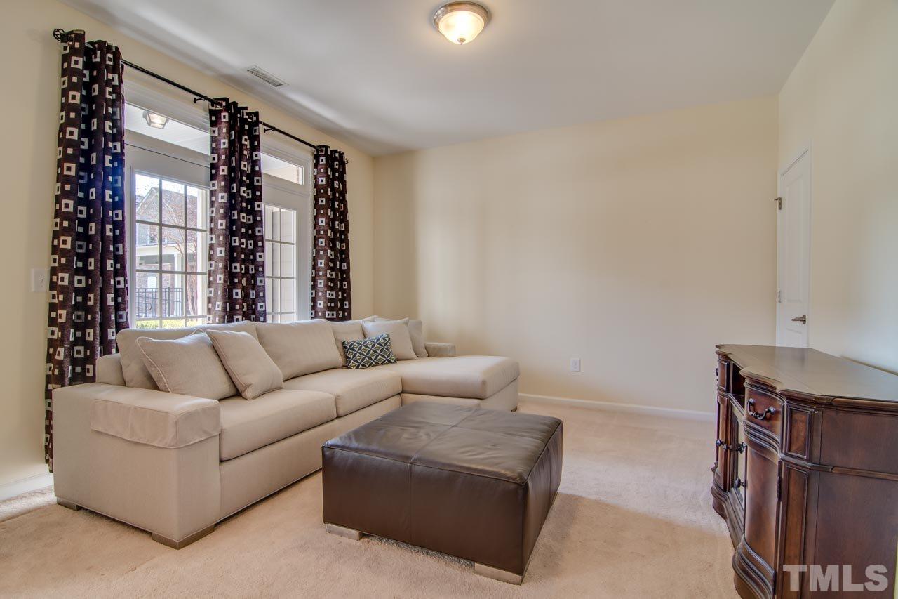 1308 Cornell Place Raleigh, NC 27607 - Photo 19 of 25 a living room with furniture and window