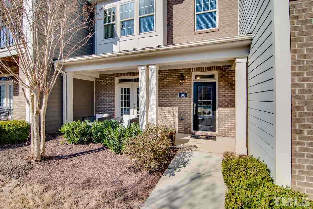 1308 Cornell Place Raleigh, NC 27607 - Photo 21 of 25 front view of a brick house with a large window