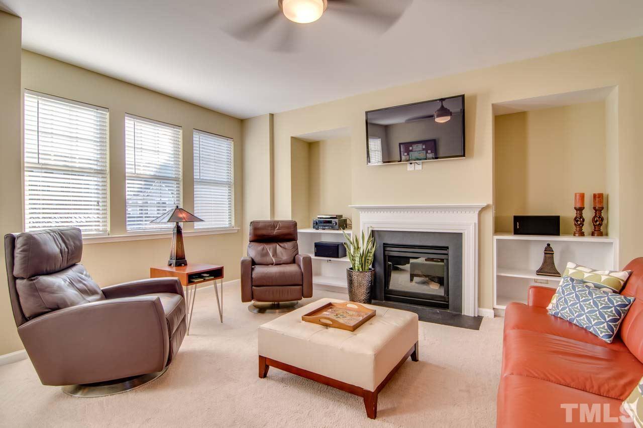 1308 Cornell Place Raleigh, NC 27607 - Photo 4 of 25 a living room with furniture and a fireplace