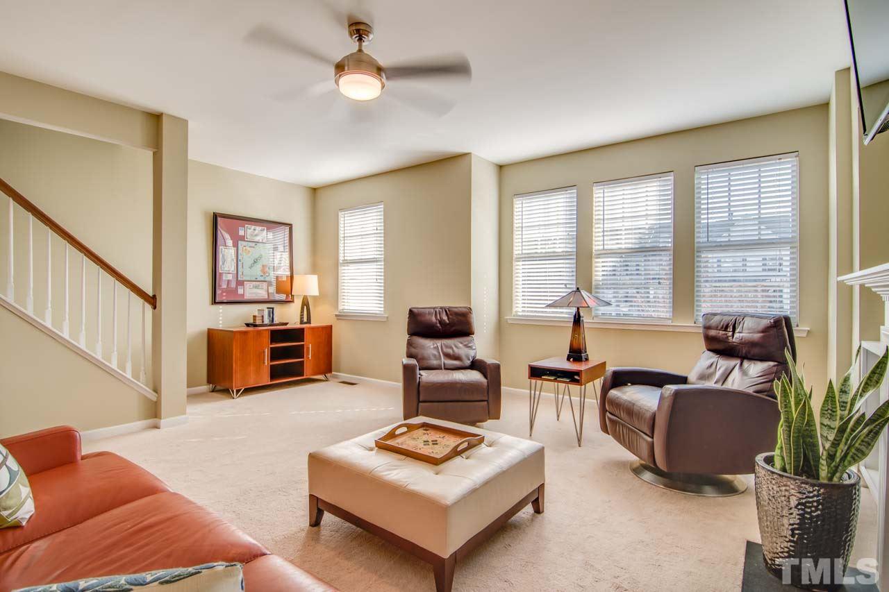 1308 Cornell Place Raleigh, NC 27607 - Photo 5 of 25 a living room with furniture kitchen view and large windows
