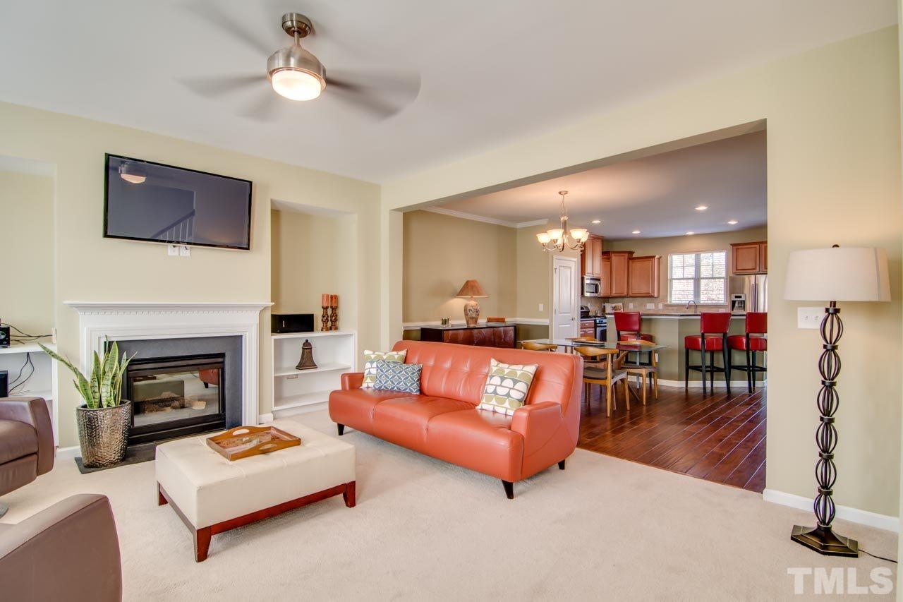 1308 Cornell Place Raleigh, NC 27607 - Photo 6 of 25 a living room with furniture and a fireplace