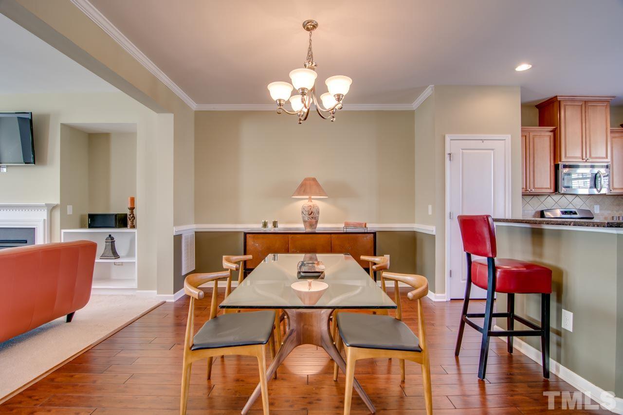 1308 Cornell Place Raleigh, NC 27607 - Photo 7 of 25 a view of a dining room with furniture and wooden floor
