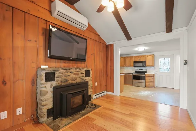 a kitchen with stainless steel appliances granite countertop a stove a microwave and a refrigerator