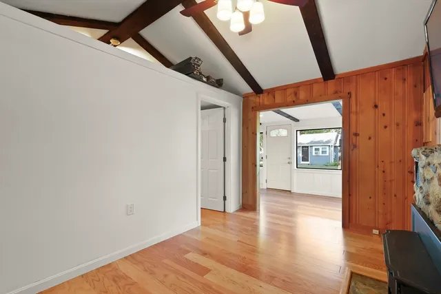 a view of hallway with wooden floor