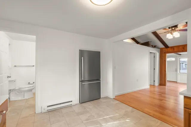 a view of bathroom with a toilet sink and a mirror